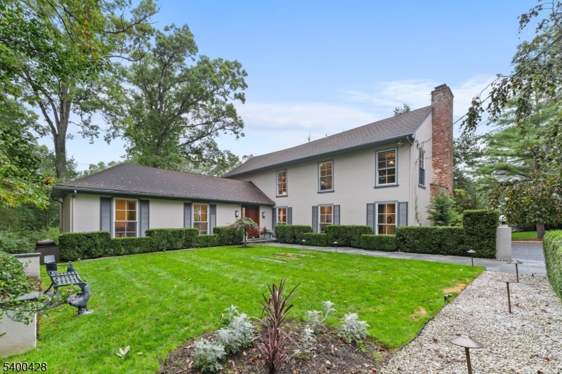 This bucolic 1.1-acre property, thoughtfully renovated in 2014, offers the perfect blend of classic character and modern comfort. Drenched in natural sunlight, the home welcomes you with inviting spaces designed for both relaxation and entertaining. The inviting family room, anchored by the home's original wood-burning fireplace, radiates warmth and charm creating the perfect setting for cozy evenings or lively get-togethers. Just off of the family room, the chef's kitchen combines high-end finishes with generous space for cooking and gathering. The primary suite serves as a private retreat, featuring a spa-inspired bath with sophisticated finishes and a serene, luxurious ambiance, plus dual walk-in closets. Set against a backdrop of lush, picturesque grounds, this residence offers a rare combination of tranquility, style, and modern living an idyllic escape just moments from everything you need, including an easy walk to Deerfield Elementary School.