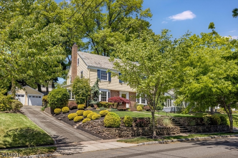Classic charm meets modern living in this quintessential Glen Ridge Colonial ideally located in the heart of town. A welcoming foyer leads to the living room with fireplace, dining room, a light and bright sunroom with vaulted ceilings, powder room and an updated kitchen with a separate seating area, ideal for comfortable everyday living. The second floor features a primary bedroom with a full bath and two additional bedrooms, while the flexible third floor offers an additional bedroom, office, and full bath ideal for guests or a work-from-home space. The finished basement adds even more room to spread out with a rec room and powder room. Outside, enjoy a fantastic backyard with two patio areas and a 2-car detached garage. Just steps from the jitney to MidTown Direct train service and close to top-ranked Glen Ridge schools, this exceptional location is also perfectly situated between the vibrant downtowns of Montclair and Bloomfield, offering easy access to dining, shopping, and entertainment.