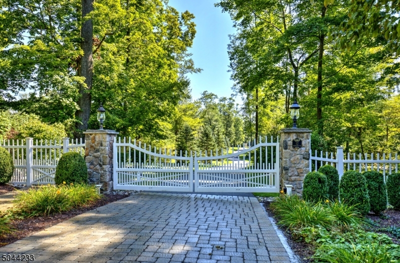 Spectacular entertaining and cozy living describe this beautiful five bedrooms, five full and two half-baths custom colonial set on six acres with golf course views. A chef's kitchen has it all. There is a six burner Wolf cooktop along with double Wolf ovens making cooking easy and the two dishwashers make clean-up a snap. A sunroom with walls of windows is a cheery room with french doors that lead out to the bluestone patio.  Some of the many added features are a shed, bluestone patio with wood burning fireplace, built-in gas grill with side burners and searing station, water fountain, generator and third floor exercise room.  This house is a pleasure to show. Please schedule an appointment with the real estate associate.