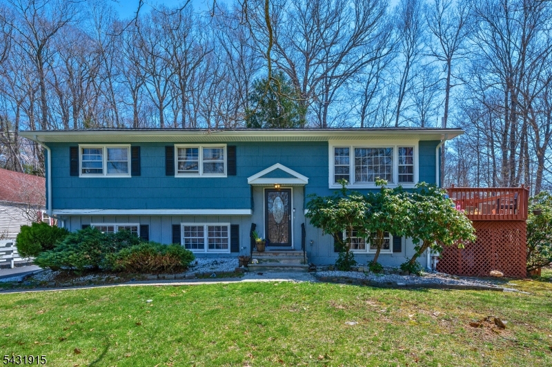 Welcome home to this beautiful 4 Bedroom, 2 Bath Bi-Level set in a tranquil, prime location.  3 Bedrooms located on the main floor.  Main bathroom with door to Primary and Hall.  A wonderful Eat in Kitchen leads to a separate Dining Room. Relax in the bright, large, Living Room with beautiful detail. Enjoy an additional 4th Bedroom on the lower level - along with a separate Laundry Room!  Enjoy a bonus office or extra room to use as well!  The large Family room has a walkout to the lovely Patio or exit to the Garage.  Entertain on the beautiful deck with Pool and enjoy your private outdoor oasis.  The roomy driveway sits alongside a beautiful large front yard.  Recent updated Septic and Chimney.  Super convenient location, minutes from major highways and all shopping.  Move right in!