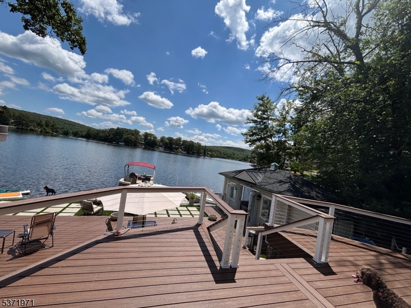 Fantastic rental at one of Upper Greenwood Lakes most beautiful homes. This is a limited term rental from SEPTEMBER 1ST to MAY 31ST 2027. Don't miss this opportunity to enjoy this fully furnished 3 br 1 bath retreat with a perfect lakefront setting and amazing down-the-lake views. There's a chefs kitchen with separate beautiful dinning space with a wall of windows facing the lake. Large living room with cathedral ceiling and original stone fireplace. Relax in the enclosed sunporch and read your favorite book. Spacious renovated bath with shower and soaking tub...you will feel like you are at the spa. Head to the downstairs game room and rack up the balls to shoot a game of pool. Walk out onto a large deck set up nicely to overlook the entire cove. Walk a few steps down to your very own boat house that offers an extra seasonal quest space. Step outside the quest house to another patio on the water. Enjoy this home year round from Apple picking at the Warwick Orchards to Skiing some of Vernon's best slopes in the winter. This place has a lot to offer