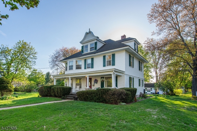 Unique opportunity to own this 116 year old Succasunna colonial on 1 acre corner lot with 2 car detached garage and workshop. Hardwood floors and beautiful woodwork throughout most of the home. French doors to the large living room. Pocket doors to the dining room. 4 bedrooms (One is currently set up as a kitchen/laundry room). 2 full bathrooms. The 2nd floor bathroom has a new granite vanity. The eat-in kitchen offers many possibilities, including a connecting small office that could become a large pantry. Large  walk-up attic. Full basement with outside access. Newer furnace & water heater. Don't miss the extra yard space to the right of the garage & workshop. Walking distance to Horseshoe Lake beach & recreation complex as well as the high school & middle school. Within minutes of shopping, dining, Routes 10, 46, 80 & 206 plus the Mount Arlington Train Station.