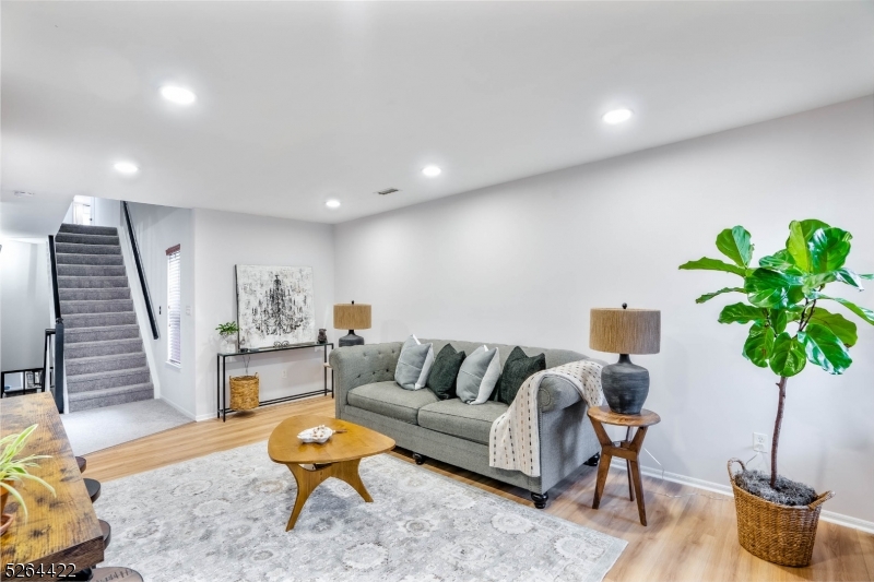 Welcoming and stunning two-bedroom, 2.5 baths townhouse at the Villas in Berkeley Heights. Inviting ground level with great size foyer, lots of closet space and access to the garage and partial basement with storage. The main level features a spacious living room with tons of natural light plus a gas fireplace perfect for winter days, modern kitchen with granite counter tops and plenty of cabinet space. Convenient powder room, laundry room and dining area with access to the balcony also on main level for convenience. Second floor with two great size bedrooms and two full baths. Master bedroom with walk- in closet, ensuite bathroom with soaking tub and double sinks. Freshley painted and new carpet throughout. Newer washer and dryer. Central AC and heating, two zones. Garage for one car and private driveway plus visitor parking available in complex. Close proximity to downtown with access to train station and public transportation. Available March 1st. No smokers or pets allowed. Tenant pays for all utilities. Background, credit check a must as well as employment verification.