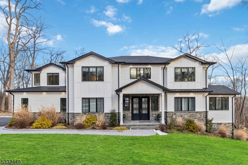 Your Dream Home Awaits! Built in 2019, this stunning 6-bedroom, 5.5-bath colonial perfectly blends luxury and comfort. From the moment you enter, you'll be captivated by rich millwork, sleek lighting, high ceilings, and impeccable finishes throughout.The gourmet kitchen is a chef's delight, featuring Sub-Zero, Bosch, and Wolf appliances, a sprawling center island, and seamless flow into light-filled living spaces with serene views and a cozy gas fireplace. A coveted 1st-floor bedroom with ensuite and mudroom off the 3-car epoxy-floored garage add convenience to the elegance.Upstairs, the primary suite is a true retreat, boasting a spa-like bathroom with a soaking tub, multi-jetted shower, and a private balcony for a peaceful mornings & sunrises. 3 additional beds, 2 full baths, and laundry complete the 2nd floor.The lower level is built for fun and relaxation, with home media room, game/pool room with wetbar, gym, bedroom/office, full bath and two walk-out exits. Smart features make entertaining a breeze -Just ask Alexa "to get the party started"! Set on a quiet 1.2-acre cul-de-sac, the home's exterior impresses with Hardie Plank siding, Azek trim, and stone accents. Full-house generator delivers piece of mind. Just a few miles away enjoy from all that Morristown has to offer- Fine Dining, Theatre, NYC trains, Etc. Take advantage of Morris School District or a plethora of nearby private schools like Delbarton, Morristown-Beard, and Villa Walsh. LIVE-WORK-PLAY Morristown!