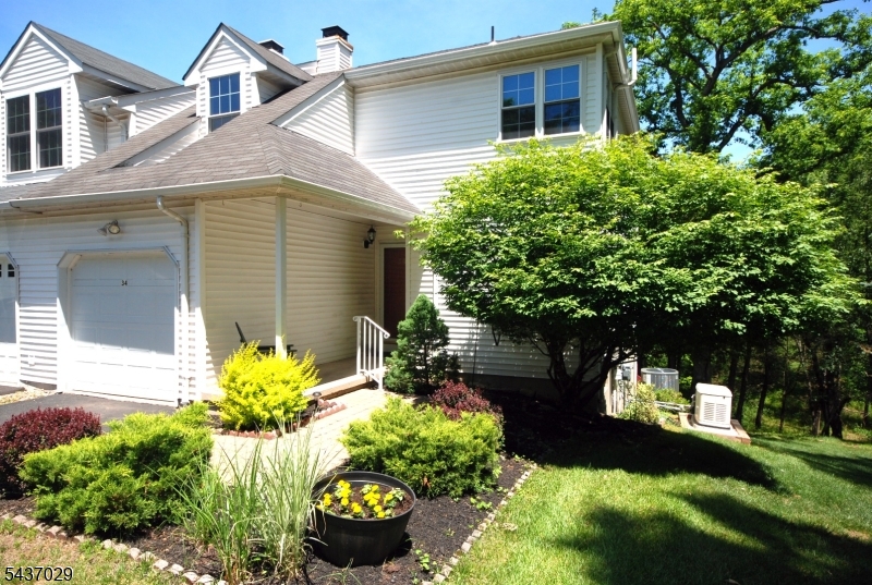 LOCATION! LOCATION! LOCATION! Welcome home to this beautifully maintained end-unit townhouse offering privacy, space, and a picturesque setting backing to serene woods. Relax on the charming rocking chair front porch or enjoy the peaceful wooded views from the deck off the living room or second deck off the family room. The spacious living room features a fireplace and walk-out to the deck creating the perfect space for entertaining or relaxing. The large kitchen boasts substantial Corian counter space, abundant cabinetry w/pullout shelving and an island breakfast bar/workspace. The primary suite offers a private bath complete with a soaking tub and shower, walk-in closet and 2nd closet. The second bedroom also boasts 2 closets and a nook area. The basement level has spacious living space, featuring a large family room with access to a second wrap around deck, a guest room with an oversized cedar closet and second walk-in closet, an office, and a utility room. Additional highlights include replaced windows and sliders, a floored attic with shelving for extra storage, a garage with a utility sink for gardeners, a whole-house generator (2024), central air (2023), and furnace (2008). Ideally located within walking distance to Silver Saddle Pool and Olde Towne Park, this home offers the perfect combination of comfort, convenience, and natural beauty. Close to major highways, train station, shopping & restaurants. LOW HOA FEE $204.91/QUARTERLY. Quick closing possible.