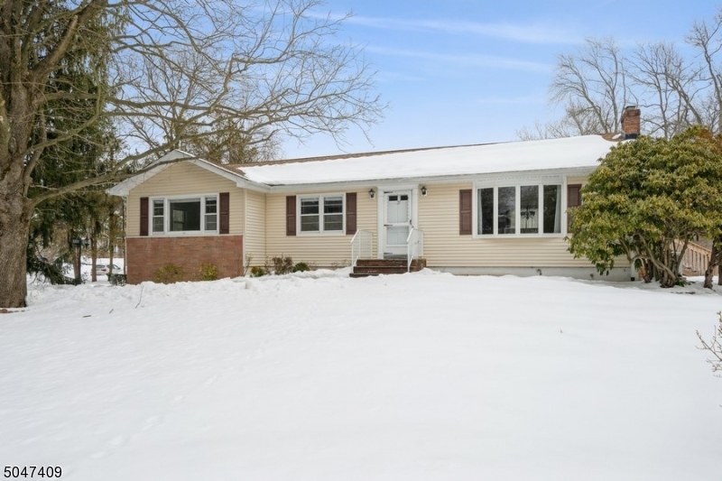 Spectacular updated 3 BR, 2 BA ranch, includes a huge master suite w/ MBR BA, 2 large BRs, & hall BA on 1st Fl. 1st Fl features a beautiful LR w/ FP & built-in shelving, spacious DR, & eat-in kitchen. All rooms showcase big windows providing bright light. Stunning full finished basement w/ entertainment/ exercise & office area. LL has a sizeable storage rm, direct access of 2 car garage w/ entrance & walkout to the backyard. The front & backyard have lovely landscaping. DR opens to a deck & yard; ideal for entertaining & playing. Smart enabled home is wired for cable tv, internet, & phone throughout the house. LR & LL equipped w/ ceiling speakers.  Close to Hwy 287, Rt 24, Rt 10, NJ Transit NY transportation, local schools, shops, dining, & entertainment.