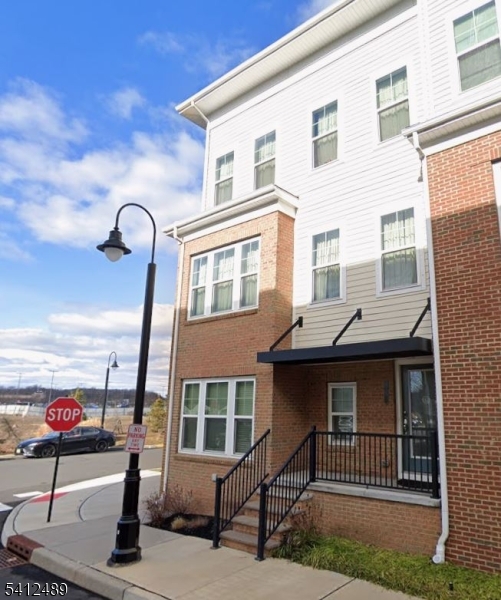 Feel the comfort & convenience of 2 Bond St! This beautiful, well-maintained 4 bedroom 3 bath townhouse boasts 4 levels of immaculate space. Enjoy the convenience as this home is ideally situated close to highways, public transportation, restaurants and shopping! The 1st floor showcases a beautiful den/bedroom area, with a full bath & garage access. 2nd floor is an open layout living/dining room & kitchen with access to an outdoor balcony perfect for outdoor grilling. 3rd floor holds the master bedroom with a master bath, as well as two other bedrooms, & washer & dryer closet. 4th floor has a den & a beautiful second outdoor balcony space. Welcome to your future home!