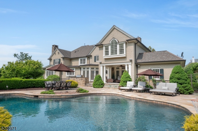 Beautiful, Bel Air classic colonial redone by renowned architect John James in 2006. 6bds, 4.2bths almost 7000 ft.  of pure luxury. Grand 2 story foyer, herringbone,hd/wd flrs, custom moldings, wood trim & coffered ceilings. European style center island, ktchn, granite countertops, travertine flrs, wolf range, top-of-the-line applncs. Butler's pantry leads into extra large dining rm. Oversize family room w/ built-ins book cases surround luxurious fireplace. Wet bar off the living room for prvte entertaining. Home office with fire place. custom built ins & French doors lead out to cozy covered porch. Magnificent bilevel backyard oasis. Walk out from kitchen to Freeform salt water pool and spa, private landscaping. Sports/basketball/pickle ball court walkout lower level, arts and crafts room, xtra bedroom and full bth. Large game room, room for future home theater. Master suite w/ vaulted ceilings, private sitting area and fireplace. 2 large, walk-in closets. 4bds upstairs, walk up attic. Too many upgrades to list.