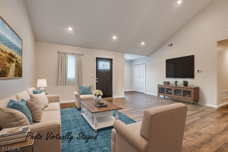 Step into this exquisite, one-of-a-kind North Edison home built in 2024. Featuring 3 bedrooms, 2.5 baths, a 1-car garage, and a circular driveway, this property blends comfort with ultimate convenience. The open layout with high ceilings, recessed lighting, and beautiful wood floors throughout. A chef's kitchen shines with custom cabinets, quartz countertops, a large center island, and LG stainless-steel appliances. Seamlessly transition to outdoor living through Anderson sliding doors onto your massive deck, complete with a newly installed jetted spa in a spacious backyard. Enjoy energy-efficient Anderson windows, updated HVAC/water heater systems, and no HOA fees. Perfectly located for commuters, just 7 minutes to Metuchen Station (direct train to NYC), 25 minutes to Newark Airport, and minutes from top shopping and major highways. VERY DESIREBLE NORTH EDISON SCHOOLS. Make this home yours today! NEWLY Installed SOLAR PANELS for Energy saving with $95 per month.