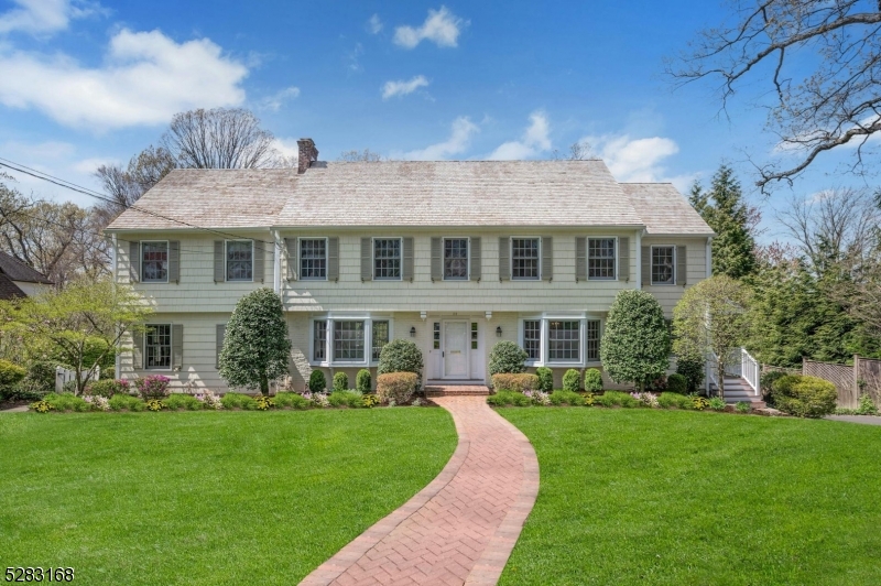 Gracious 5 bedroom 4 full 2 half bath colonial situated on a half an acre in one of Summits most desirable locations. Meticulously maintained, the first floor boasts formal living and dining rooms, oversized office with cherry paneling and built in book shelves, white kitchen with stainless steel appliances, adjacent family room, butlers pantry, laundry  and mudroom. Second floor hosts all 5 bedrooms with 2 primary suites, and three other large bedrooms with 2 other full baths. Spacious lower level with game and recreation rooms.  A gem...not to be missed.