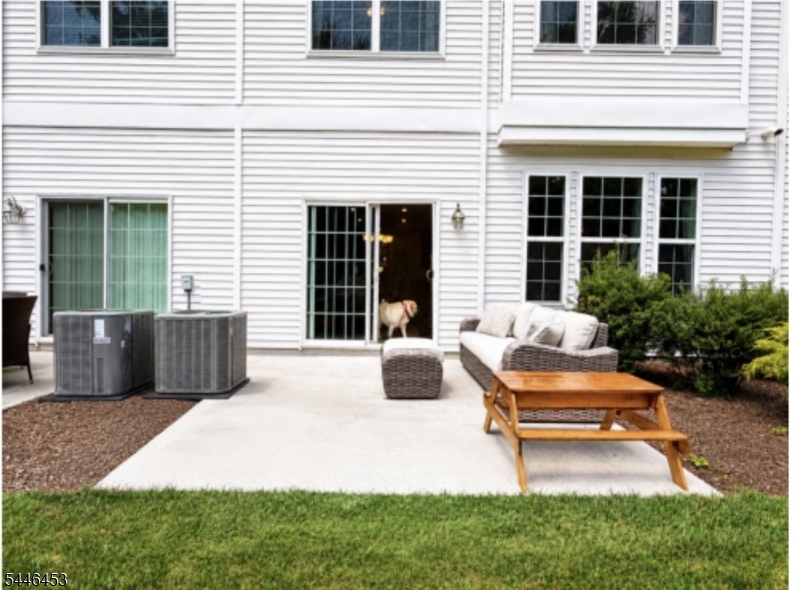 Welcome to this beautifully appointed 2 bedroom townhome offering a perfect balance of elegance, functionality, and low-maintenance living in one of Rockaway Township's most convenient locations. Just moments from shopping, restaurants, entertainment, and major commuter routes, this home delivers both comfort and accessibility. Inside, you'll find an airy interior highlighted by 10-foot ceilings, expansive windows, and high-end finishes that create a bright, open feel throughout. The thoughtfully designed floor plan includes three full bathrooms, providing added convenience for overnight guests. The primary suite features a spacious custom walk-in closet and a beautifully designed private bath with dual vanity and a separate water closet. At the heart of the home, the stylish kitchen showcases granite countertops, stainless steel appliances, a decorative tile backsplash, generous counter space, a peninsula with seating. Flowing effortlessly into the dining and living areas, the layout is ideal for hosting or simply enjoying everyday life. Additional features include a dedicated laundry/mud room, ample storage, and an outdoor patio overlooking tranquil green space an inviting spot to unwind or entertain. A combination of modern design and Prime Location, this move-in-ready home offers an outstanding opportunity to enjoy carefree townhome living.
