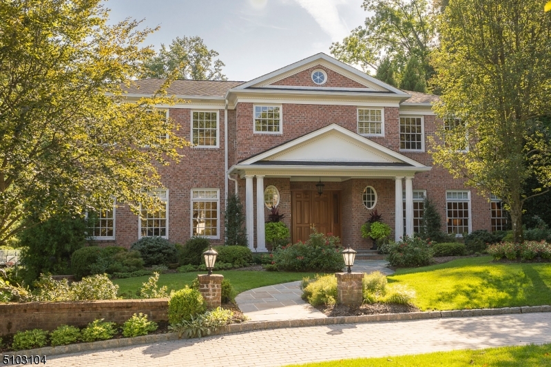 Classic & elegant center hall will impress you at first glance with its beauty & desirable location. This comfortable home has everything that you need for the ideal suburban lifestyle. Overflowing with details including high ceilings, custom millwork & special features throughout the sun drenched,  spacious rooms coupled w/ great flow, create the perfect venue for entertaining, both in & out. You will be drawn to the 0.81 AC professionally landscaped property including a playing field sized rear yard, just steps off of a custom stone patio w/ built-in grill, & a secluded lower yard for quiet relaxation. The entire yard is fenced in & surrounded w/ perimeter trees for privacy. The grand entrance Foyer is the focal point leading to the tastefully appointed formal Living & Dining Rms, Library & rear Terrace. Gourmet Kitchen is the perfect gathering space w/ its custom Shaker cabinets, top of the line appliances & huge center island. Separate breakfast dining, butler's pantry & wet bar are bonus features. Open to the Kitchen, the Family Rm w/ WBFP set off by stone hearth & surround, offers amazing views of the rear. Glorious open staircase to second floor w/ 5 generous BRs incl Primary Suite w/ WBFP, Sitting Rm, 3 WICs & luxurious bath. Finished walkout Lower Level w/ Rec Rm, Guest BR, full bath & Home Gym. Access to 3 car garage. Full House Generator. Ideally located within steps to award winning Hartshorn School & close to NYC direct trains. All you can imagine is right here!