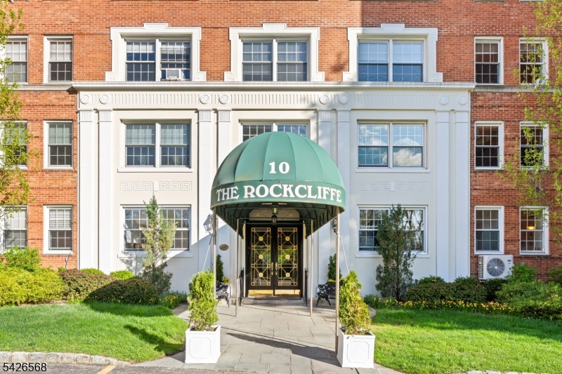Welcome to this beautifully maintained one bedroom, one bathroom co op located in an elegant pre war Georgian brick building, rich with timeless architectural charm. Perched atop First Mountain, this residence offers a unique blend of classic character and serene surroundings. The building is set on private, park like grounds featuring a beautifully landscaped garden patio and a tranquil fountain, perfect for enjoying peaceful outdoor moments. Inside, the home boasts high ceilings and spacious sun filled rooms that create a warm and inviting atmosphere. Residents enjoy the convenience of on site laundry, with parking available for just $35 per month outdoors or $60 per month in the garage. Storage units are also available with a waitlist. The monthly maintenance fee covers heat, hot water, gas, sewer, trash, property taxes, concierge service, an on site resident property supervisor, and maintenance of the common areas, offering true ease of living. A rare opportunity to own in a distinguished building that combines historic elegance with everyday convenience.