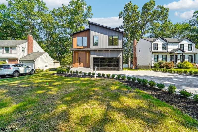 Welcome to this Exceptional New Construction featuring 6 spacious bedrooms and 5.5 luxurious bathrooms, thoughtfully designed for both elegance and everyday functionality. Built in 2025, this home is full with natural light and showcases state-of-the-art upgrades and high-end finishes throughout. Enjoy the comfort and energy efficiency of spray foam insulation, along with smart home integrations including Sonos speakers, a camera system, wired router, generator hookup, and EV (smart car) charging station. The beautifully designed exterior includes custom paver work in the driveway and back patio, as well as a full irrigation system to maintain pristine landscaping. Step into the incredible primary suite, where a spa-inspired bathroom and expansive custom closets create a serene retreat. Each bathroom in the home features modern, sleek finishes that reflect today's most desirable design trends. .Every corner of this home is designed to impress, offering the ultimate in modern living with comfort, technology, and sophistication. The home features top of the line finishes, equipped with security cameras, speakers, high speed internet and intercom system, premium kitchen appliances by Cafe, and Bella window. The House comes with 10 years builder warranty.