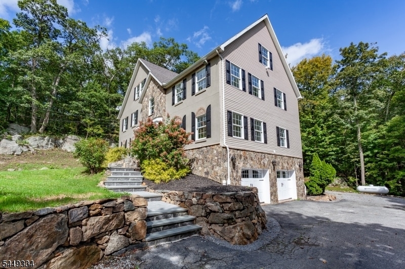 Stunning Colonial with Luxury Finishes & Great Commuter Location in area of all large homes. Step into this exceptional, beautifully maintained Colonial featuring a striking stone and stucco exterior and paver walkway.  Magnificent entry Foyer, Formal Dining Room & Custom Eat-In-Kitchen which has Marble Floors Granite Counters, Stainless Appliances, Crown Molding, Marble Floors, Recessed Lighting, Large Pantry, Living Room with Gas Fireplace, warm and comfort and flexibility for everyday living and entertaining. All Spacious Rooms, Large Pantry, Recessed Lighting. Central Air (Heat, 6 Zones.) Full Finished Walk Out Basement, Four spacious bedrooms, 2 Full & 1/2 Baths. Master Bedroom with En-suite, Full Walk Up Floored Attic with 8' Ceilings.  Septic installed 2023.  Home Shows Well, Close to all highways, and town for shopping, Minutes from Skiing, Warwick Valley Winery & Distillery, Golf, Mountain Creek, Crystal Springs.  So Much to offer, Amust-see home that shows its pride of ownership[.