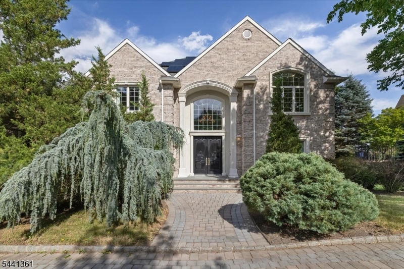 Nestled on a private nearly 1-acre cul-de-sac lot atop prestigious Dey Hill, this exceptional custom home offers the perfect combination of luxury, privacy, and comfort. Built in 2004, the 4,603sqft residence features gleaming hardwood floors, high-end finishes, and a thoughtfully designed floor plan ideal for everyday living and entertaining. A dramatic 2-story foyer opens to a stunning living room with soaring ceilings, connected by an elegant gallery balcony. The layout flows seamlessly between the family room, dining room, and an additional living area. A versatile 1st-floor bonus room is ideal as a home office, playroom, or guest room. The gourmet kitchen features premium Viking appliances, abundant cabinetry, and a large center island that serves as the heart of the home. The primary suite offers a spa-inspired bath, a generous walk-in closet, and an adjoining bonus room ideal as a dressing room, office, or fitness space. A 2nd bedroom offers an ensuite bath, while 2 more share a spacious full bath. A 3-car garage with 3-EV connections, an efficient hydro heating system, and a whole-house multimedia system add to the home's appeal. The basement offers 11-ft ceilings with an expansive walkout, full of possibility. Mature landscaping ensures privacy, with a tranquil pond and spacious deck for outdoor enjoyment. Conveniently located near major highways, shopping, and dining, this residence offers an exceptional lifestyle in one of the area's most desirable neighborhoods.