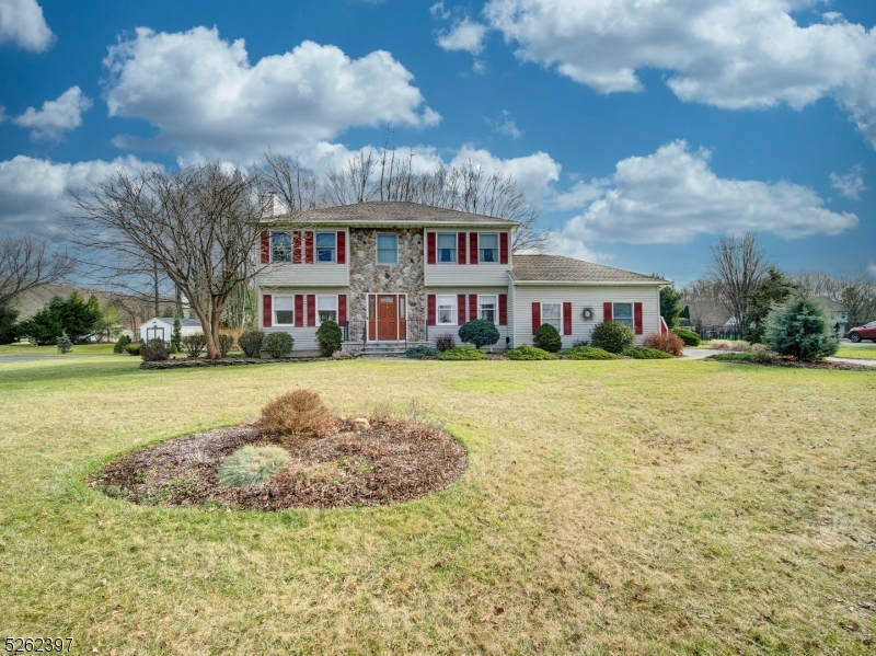 Pride of ownership abounds here as this home has been meticulously maintained by its original owners and it's located in a desirable Succasunna neighborhood. It has attractive curb appeal giving a great first impression of this beautifully appointed home. This gem features 4 bedrooms & 2.5 baths, nicely updated kitchen, updated baths, wood floors, gorgeous wood burning stone fireplace and huge laundry room with access to deck. Living room and family room have been blended for more spacious look yet still provides two distinct functions. Formal dining room is perfect for your special occasions. Sliding doors off the kitchen lead to an entertaining sized deck overlooking the large, flat, tree lined yard. There are two sheds and a second deck in the backyard. Newer bay window in the living room. Primary bedroom will delight. It features a walk in closet and updated full bath with spa like tub/shower.  Three additional bedrooms and a full bath complete the second level. Full basement is ready for finishing. Other features include some crown molding, two car garage & PUBLIC UTILITIES!   Conveniently located near major roadways, Horseshoe Lake Park, shopping & restaurants. ONE YEAR HOME WARRANTY INCLUDED.  DON'T MISS THIS ONE!