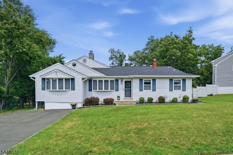 Tucked away on a quiet cul-de-sac in Little Falls and lovingly cared for by the same family for over 40 years, this spacious split-level offers an incredible amount of living space and a flexible layout. The main level features a large living room with vaulted ceiling, formal dining room and eat-in kitchen. Four bedrooms upstairs plus a den/home office and full bathroom. The spacious primary suite features an oversized en-suite bath, walk-in closet and access to a private deck connecting to the den. The ground level offers even more versatility with a family room, large recreation room, laundry room, half bathroom and walkout access to a large, private backyard, plus exciting possibilities for extended living or guest accommodations. Hardwood floors and ample storage throughout. Enjoy the quiet of suburban living just minutes from Montclair, near schools, shopping, dining, train and bus service, with easy access to Routes 3, 46 and 80 and multiple options for commuting to NYC. So much space, flexibility and potential in a location that keeps you connected to it all!
