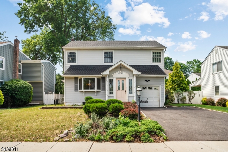 Welcome to this charming 4-bedroom, 2-full bath Colonial perfectly situated in the desirable "Boulevard" section of Kenilworth. This home features classic hardwood flooring throughout and a functional layout including a full basement. A unique highlight is the first-floor extension, which offers a fantastic opportunity for future expansion of the second level. The exterior boasts a fully fenced-in yard, a built-in garage, and a double-wide driveway providing ample off-street parking.Located on the "downtown artery" of Kenilworth, this property offers an exceptionally walkable lifestyle. Enjoy immediate access to a vibrant mix of local "mom-and-pop" shops, restaurants, salons, and municipal offices. Nature enthusiasts will appreciate the proximity to lush green spaces, including Lenape Park, Nomahegan Park, and the Galloping Hill Park and Golf Course. Combining a tight-knit, small-town atmosphere with convenient access to major highways and public transportation, this home offers the best of suburban living.