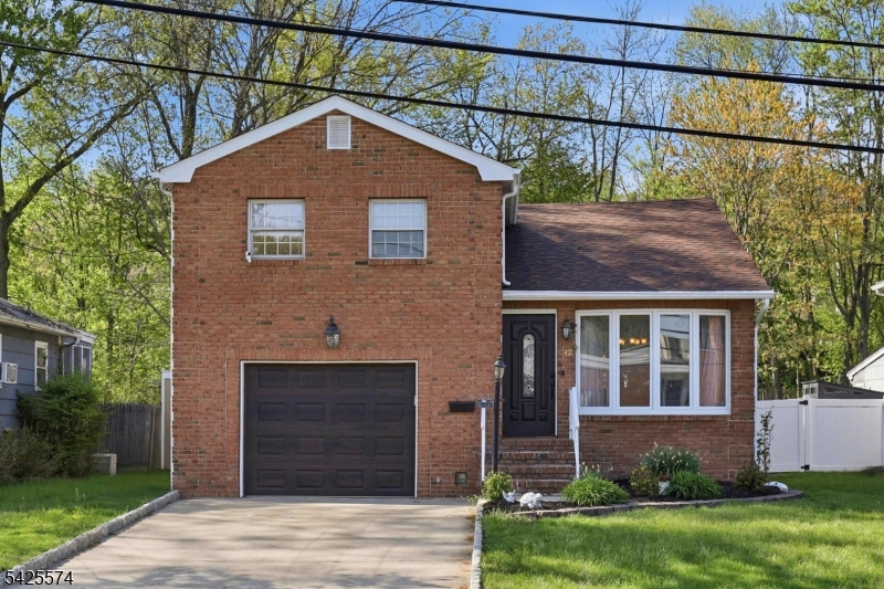 Welcome to this beautifully maintained home in the highly desirable town of Green Brook! Known for its top-rated, Blue Ribbon schools, this location offers both convenience and a wonderful community feel. The home features a charming brick front and has been freshly painted inside and out, along with new windows that enhance both efficiency and style. Inside, you'll find generously sized bedrooms and two beautifully updated full bathrooms with Kohler finishes. At the heart of the home is the expansive family room, perfect for relaxing, entertaining, or everyday living. A huge attic provides exceptional storage space, while a large, recently redone shed offers even more room for organization. Step outside to enjoy the private, fenced-in yard complete with a brand new fence creating the perfect setting for outdoor gatherings, play, or simply unwinding.