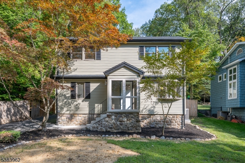 Welcome to this charming and fully renovated Cape Cod in the desirable Rock Ridge community of Denville, NJ. This 3 bedroom, 2 full bath home has been professionally updated with high-end finishes and modern amenities, blending classic charm with contemporary living. Step inside to an open concept living space that flows into the stunning, light filled kitchen. The gleaming hardwood floors and white walls create a bright and airy feel. The kitchen features brand-new stainless steel appliances, a sleek island with a deep sink, white shaker cabinets, and beautiful dark granite countertops. This open layout, complete with recessed lighting, skylights, and cathedral ceilings is perfect for entertaining and everyday life. Enjoy the outdoors from the enclosed porch, which offers a comfortable space to relax and overlooks the beautifully maintained yard. The home also includes a nice sized backyard with a shed for extra storage. This home has been completely transformed from top to bottom. It features central air, all public utilities and is minutes to downtown Denville with convenient access to highways, NJ transit, and top rated schools. Rock Ridge Lake offers a clubhouse, beach, swimming, and boating facilities, along with nearby hiking trails.