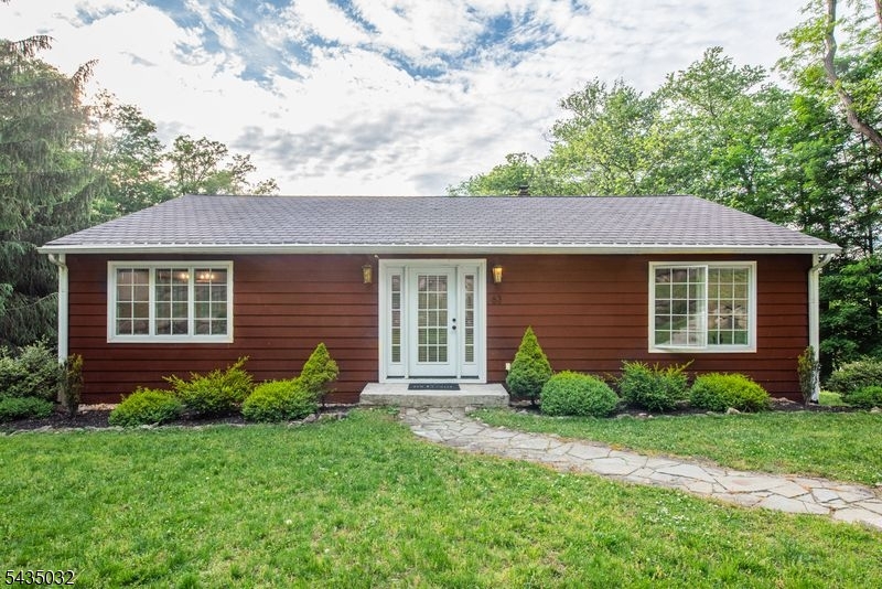 This completely updated ranch-style home beautifully blends modern luxury with a versatile floor plan and incredible expansion potential. As you enter, you are greeted by an open-concept living space featuring vaulted ceilings, abundant recessed lighting, and premium Andersen windows that flood the home with natural light while providing excellent energy efficiency. The gourmet kitchen is a chef's dream, boasting custom self-closing cabinetry, a double oven, and a massive side-by-side refrigerator.The main level features two spacious bedrooms, including a primary suite complete with generous walk-in closets and a luxury bath featuring a relaxing jetted tub. A second full bathroom on this level features a convenient separate shower. The lower level offers tremendous versatility with a massive third room, a dedicated laundry and storage area, and a practical workshop space equipped with a workbench.Step outside to enjoy a relaxing patio, a convenient storage shed, and beautiful views of the surrounding nature. Best of all, this home features an oversized two-car garage, central A/C, and is within easy walking distance to Burnham Park and vibrant downtown Morristown.