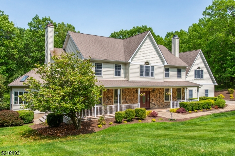 Enjoy ultimate privacy in this custom built, recently remodeled home at the end of cul-de-sac on 2.6 acres backing to preserved land. Featuring a gorgeous chef's kitchen renovated in 2019 with 48" Wolf range, Sub-Zero fridge, custom lighted cabinetry, and center island with granite counter tops, which is open to the family room.  Wood-burning fireplaces in dining room and family room (two-sided) with double French doors leading to bright sunroom, with vaulted ceiling and skylights. Primary suite includes an outfitted walk-in closet, spa-like bath (2021) with walk-in shower, soaking tub, and fabulous dual vanity area with built-in lighted mirror. Tremendous closet space throughout including additional walk-in closet in upstairs hall. Huge bonus room above the attached three-car garage. Laundry room and 1.5 additional baths round out the upper level. Work from home in the convenient first floor office or additional office in the walk-out finished basement (2022) with high ceilings, full bath, large recreation area, and additional storage. Hardwood flooring throughout the first level. Large deck off kitchen and wrap-around front porch provide wonderful spaces for soaking in the morning and afternoon sun. Minutes to NJ Transit Gladstone train, major highways & quaint Chester town center with shops, restaurants, farm markets and parks. Highly rated Chester schools & West Morris Mendham High School offering the International Baccalaureate and outstanding sports and arts programs.
