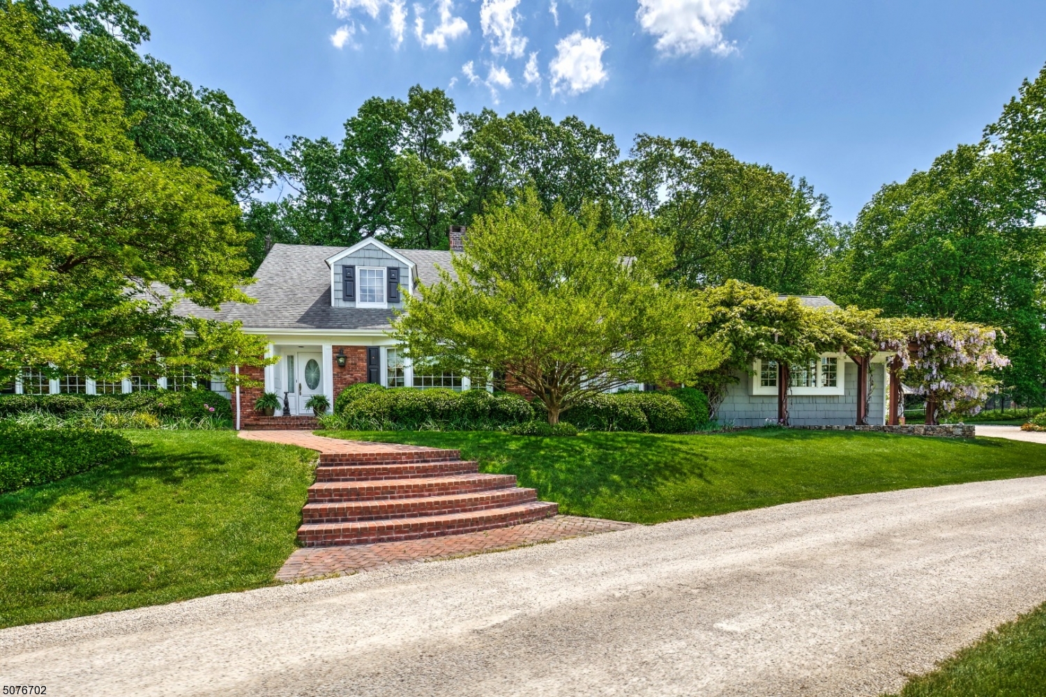 Exquisitely appointed for entertaining and everyday living, Northwood Farm in New Vernon is partially sited on land that was once part of the Seth Thomas estate of clockmaking fame. This bright, airy, modern residence measures nearly 5000 square feet & is surrounded by over 6.5 acres of serene & gorgeously landscaped property. A long winding driveway edged by open fields, manicured lawns & mature trees leads to this graceful home. A tennis court & sunken blue-stone terraces edged by colorful gardens lend additional charm. Inside a flowing floor plan offers 11 rooms: 4 BRs, 4 1/2 baths & 3-car garage with Tesla charging & expansive bonus room above. Highlights of the sun-splashed layout include multi-layered millwork, library w/coffered ceiling, epicurean chef's kitchen, lux primary suite.
