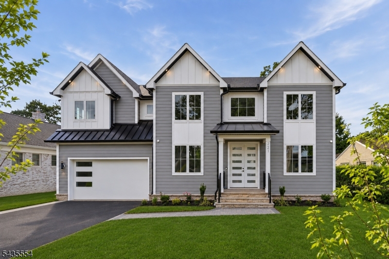 Designed for elevated everyday living & entertaining in desirable Westfield, this striking NEW CONSTRUCTION custom center hall colonial offers over 4,700 sq ft across 4 finished levels w/ 6 BR & 6.5 baths on a serene 0.24-acre lot on a quiet street.A dramatic 2-story foyer opens to an open-concept layout connecting the formal dining room to a gourmet kitchen featuring custom cabinetry, Thermador appliances, center island, butler's pantry & walk-in pantry.Hardwood floors, custom trim & designer accent walls enhance the home's sophisticated aesthetic.The open layout w/ 10-ft ceilings is anchored by a breathtaking family room w/ vaulted ceilings, built-in speakers & a striking 20-ft marble & wood plank fireplace, while sliding doors lead to a patio overlooking the flat backyard, ideal for entertaining or a future pool. The first floor also includes an ensuite bedroom, mudroom & powder room. Upstairs features 4 additional bedrooms & 3 baths, including a luxurious primary suite w/ his-and-her walk-in closets & a spa-like bath with dual sinks & glass shower, plus laundry room.The finished attic offers flexible space w/ a full bath and rec room or office, while the finished basement w/ 9-ft ceilings includes a rec room with wet bar, media room, bedroom, full bath & built-in speakers. Additional highlights include smart thermostat, Ring doorbell camera, EV charger & 10-Year Builder's Warranty. Convenient to parks, award-winning schools, downtown Westfield, NYC trains & the GSP.