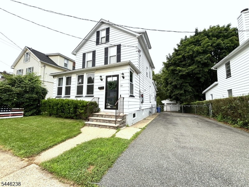 Beautifully maintained Colonial in true move-in condition! This warm and inviting home blends timeless charm with everyday comfort, offering a classic floor plan with 3 bedrooms, a bright and welcoming living room, and a formal dining room perfect for entertaining. The generously sized kitchen provides plenty of space for cooking and gathering, while thoughtful upgrades including a Tesla solar system, water softener, and instant hot water heater ensure efficiency and everyday convenience. An enclosed back porch adds additional living space, ideal for relaxing and enjoying the changing seasons. Step outside to a flat, level, fully fenced backyard featuring gardens and a patio perfect for outdoor enjoyment. A detached garage adds convenience, and the home's location puts you just minutes from the town center, transportation, and easy access to major highways, including Routes 46 and 80. A wonderful opportunity to own a charming home that offers character, comfort, and convenience all in one!