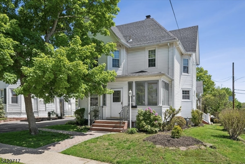 Well-maintained 3-bedroom, 3-bath Colonial on a desirable corner lot in Dover, offering classic charm, flexible living space, wood floors on the main and second levels, and a location that connects everyday convenience with nearby parks, shopping, dining, and commuting options. Step inside to a sun-filled main level where the spacious living room flows easily into the dining area, creating an inviting setting for daily living and entertaining. The eat-in kitchen features stainless steel appliances and ample cabinetry, while a full bath, first-floor laundry, and mudroom add comfort and practicality. Upstairs, 3 bright bedrooms offer comfortable retreats with wood floors, great natural light, 2 with generous Walk-in-Closets. The finished attic level adds a wonderful bonus area ideal as a cozy gathering space, playroom, guest area, home office, or creative retreat. The finished lower level expands the home even further with a full bath and flexible recreation space ideal for guests, work-from-home needs, or casual gatherings.Outside, enjoy a private deck for relaxing, dining, or entertaining. An owned driveway and detached 1-car garage add even more value. Close to Hurd Park, Hedden Park, major highways, transportation, and NJ Transit service to NYC, this rare find combines space, convenience, and potential in a prime Dover location. Additional highlights: Roof 2024, Water Heater 2022, AC unit 2020. Owner lic NJREC agt