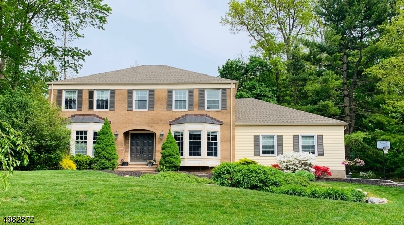 This is the house you have been waiting for.  Just unpack your bags and move into this charming center hall colonial with architectural details located on a peaceful tree lined street. The kitchen with white cabinets, stainless steel appliances, and large pantry  opens to the family room with a wood burning fire place. From the kitchen, step out to the over sized deck where  you will enjoy summer BBQ's and over look the large private backyard. On the second level the master bedroom boasts a large walk-in closet with custom cherry wood built-ins. All bathrooms have been updated and the luxurious master bath features a large soaking tub, tray ceiling and walk-in frame less glass door shower with 3 shower heads. Fun times will be had in the finished basement.  Don't miss out.