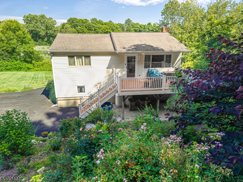 Privacy abounds in this extremely pleasing 3-bedroom raised ranch, perfectly situated on a .46-acre lot  backing to Wawayanda State Park. This home offers a serene natural setting and a layout designed for comfort and flexibility. A welcoming front deck overlooks lush, season-long landscaping?an ideal spot to relax and unwind any time of day. Inside, you?ll find spacious rooms that can be utilized to fit your lifestyle, with endless possibilities. The updated kitchen and bathroom add modern convenience, while the floor plan provides versatility with two bedrooms on the main level and a third bedroom on the ground floor. The lower level offers its own entrance from the rear if preferred, along with a cozy family room featuring a pellet stove, a wonderful alternative heating source that helps with utility costs. Outdoors, enjoy a fully fenced backyard and a level lot that enhances your outdoor living and recreation.A truly pleasing home offering comfort, privacy, and a beautiful natural backdrop.  Minutes to Warwick NY, this home is located in The Barry Lakes Community that offers Lake Living at its Best !