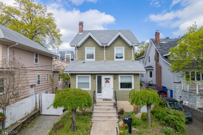 This beautiful 3-bedroom home in desirable Cliffside Park offers the perfect mix of modern updates and classic charm. The main floor features an enclosed porch, a living room with wood-burning fireplace, and a formal dining room that opens into a renovated kitchen with a center island. The second floor offers 3 good-size bedrooms and a renovated bathroom. The high-ceiling walk-out basement is ready to be finished for extra living space featuring the second renovated full bathroom. Outside, you'll find a rare 3-car garage!!!! plus a driveway for 3 more cars. The deep backyard is an entertainer's dream, featuring a garden, a built-in pizza oven, and a large deck sitting right on top of the garages. Located within walking distance to NYC transportation and local shops, this home is a must-see. Low Taxes $8,756! Schedule your showing today.