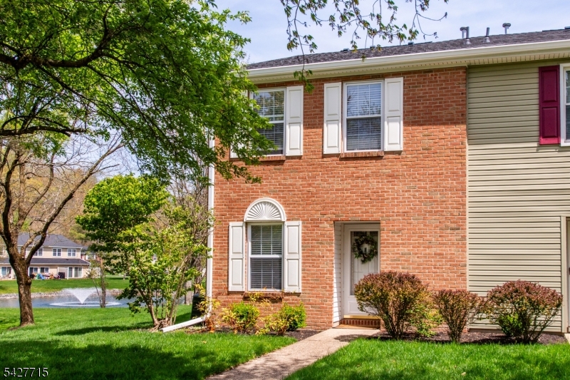 Welcome to this delightfully updated end-unit townhome in the desirable Deer Run Golf & Tennis Community. Featuring two bedrooms each with their own en-suite bathroom upstairs, plus a half bathroom on the main floor, this home offers a bright, open floor plan filled with natural light. The main living area is warm and inviting with a cozy gas fireplace, perfect for relaxing or entertaining. Step outside to your private, updated Trex deck overlooking a peaceful pond an ideal setting for morning coffee or evening unwinding. Major updates include the furnace, central air, and water heater, all just 2 years old, as well as a new roof (2025), for added peace of mind. Enjoy resort-style amenities including a free 9-hole golf course, seasonal outdoor pool, tennis and pickleball courts, and a clubhouse. Conveniently located near major highways, shopping, dining, parks, and public transportation, this move-in ready home offers the perfect blend of comfort, convenience, and lifestyle.
