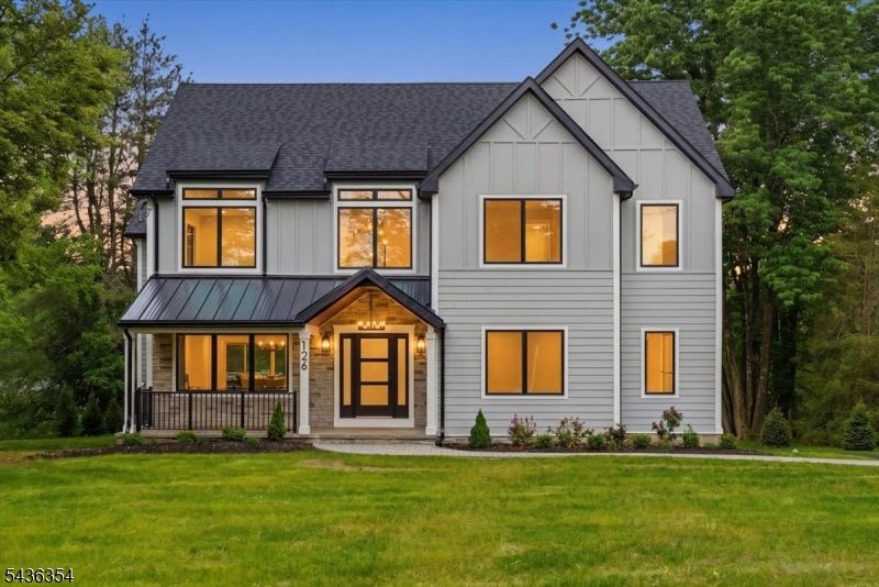 Thoughtfully reimagined with exceptional attention to detail, this stunning Berkeley Heights Colonial offers 4,500 sq ft of finished living space on an expansive 3/4-acre property. Blending timeless architecture with sophisticated modern design, the home delivers the quality, comfort, and lifestyle today's luxury buyer seeks. A light-filled interior welcomes you with an open-concept layout designed for both everyday living and entertaining. The custom-designed chef's kitchen showcases Taj Mahal quartzite countertops, stainless steel appliances, an oversized center island, walk-in pantry, and seamless flow into the dining area and family room with gas fireplace. Smart lighting enhances convenience and ambiance. The main level offers both a private office and first-floor bedroom suite. Upstairs, the luxurious primary suite features vaulted ceilings, a gas fireplace, private balcony, dual walk-in closets, and a spa-inspired bath. Three additional bedrooms provide spacious accommodations with access to well-appointed baths. The finished walkout lower level expands the home's versatility with spaces ideal for a media room, fitness studio, or home office. Conveniently located near schools, shopping, major highways, and NYC trains, this exceptional home offers a blend of luxury, craftsmanship, and convenience.