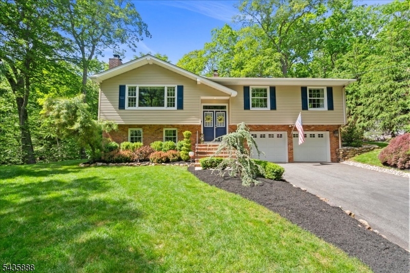 Amazing fully updated bi-level in the highly sought-after Lake Valhalla neighborhood, offering beautiful water views and pristine, move-in-ready condition. This meticulously maintained 3-bedroom home features 2,116 sq. ft. of thoughtfully designed living space, gleaming hardwood floors, Andersen windows, a 16kW whole-house backup generator, and an underground sprinkler system.The entry Foyer features a Schonbek Chandelier with Swarovski Strass crystals that is attached to a winch for easy cleaning.The stunning center-island kitchen boasts granite countertops, stainless steel appliances, and ample space for cooking and entertaining. The spacious family room offers walkout access to a private patio overlooking a babbling brook, creating a peaceful retreat. Warm and inviting wood burning fireplaces in the living room and family rooms.Enjoy outdoor living on the expansive Trex deck and level backyard that backs directly to parkland for added privacy.Ideally located adjacent to The Glen hiking trails and within the top-rated William Mason K-5 School district. Large 24x23 heated two car garage Optional Lake Valhalla membership provides access to swimming, sailing, tennis, pickleball, volleyball, and a variety of community activities. A rare opportunity to enjoy updated living, natural beauty, and one of Montville's most desirable neighborhoods.