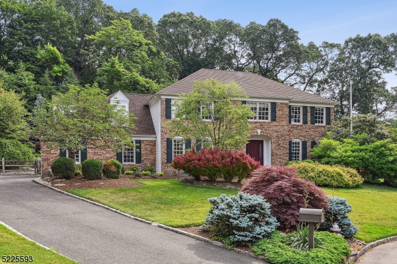 Stunning Colonial at the end of a cul-de-sac on coveted Woods Lane! This  4 BD/3.5 BA private oasis in Chatham Boro is an entertainer's dream.  The thoughtfully designed main living and entertainment space offers exceptional details, including a light-soaked great room with a stone fireplace, cathedral ceilings, a sophisticated living room and formal dining room. The oversized gourmet kitchen will surely impress with its massive island, SubZero refrigerator and beverage drawers, Wolf range, and custom cabinetry. Upstairs, the gracious Primary Suite is a real retreat w/ an updated full bath and two large walk-in closets, custom fitted by California Closets. There are 3 more roomy bedrooms and an updated full hall bath w/ double vanities. The fully renovated lower level offers the perfect playroom or hangout spot, with its large rec room and convenient full bath. The sprawling outdoor entertainment space includes a heated inground pool, a fire pit, and a lovely patio with multiple seating areas. The wide yard and plenty of open space is ideal for more active play.  Additional features include a full house generator, large outdoor shed, and attached 2-car garage. Enjoy all Chatham has to offer including the charming downtown shopping, restaurants and train to NYC. Close to award-winning schools, this unique property is not to be missed!