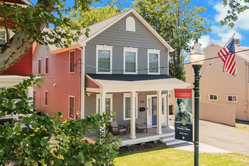 Perfectly positioned in the heart of Scotch Plains, just one block from vibrant downtown, this exceptional 4 BR, 3 full BTH Colonial offers the ideal combination of modern living & an unbeatable location. Enjoy convenient access to restaurants, shops, community events, the popular weekly farmers market, NJ Transit, major HWYS, virtually every shopping convenience imaginable, & the scenic trails of Watchung Reservation. Built in 2024, the home features a bright, open floor plan, quality craftsmanship, & thoughtful finishes throughout. The beautifully appointed KIT serves as the heart of the home with quartz counters, designer cabinetry, SS appliances, & a center island. HDWD FLRS, spacious rooms, abundant natural light, & built-ins enhance both style & functionality. The LR features a built-in entertainment wall w/ storage, display shelves, closet, dedicated space for a large-screen TV. Spacious flex space off the bedroom wing provides valuable additional living area for today's lifestyle needs. BR#4/Office features a Murphy bed w/ integrated storage. Custom window treatments throughout are included. Convenient 2nd FL laundry room w/ additional storage (washer/dryer negotiable). Unfinished BSMT provides ample storage space. Large private backyard w/ patio. Extra fridge in garage included. A rare opportunity to own a newer home in one of Scotch Plains' most desirable locations, offering the perfect blend of newer construction, modern amenities, & exceptional in-town living.