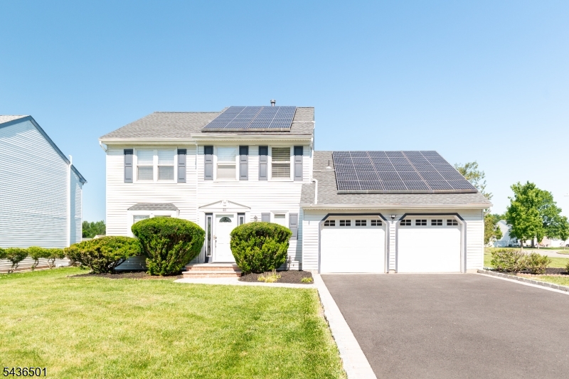 A hidden gem in one of Piscataway's most sought after communities! This beautifully updated 3 bed, 2.5 bath colonial sitting on a large park-like corner lot, is a must see! Newer driveway with Belgium block and paver accent border and walkway plus 2 car garage, surrounded by meticulously maintained landscaping with sprinkler system. Inside, hardwood floors throughout most of home. Large, sun-drenched living room, open to large formal dining room.Fully renovated kitchen with large center island. White quartz counters, white shaker cabinetry, s/s appliances and stainless herringbone tile backsplash, plus recessed lights and modern pendant lighting over the island. Step down family room with wood-look tile floors running from the kitchen and foyer. Sliders to backyard and wood-burning fireplace complete this cozy room. Mudroom with laundry and updated powder room finish off this level. Upstairs are 3 generous sized bedrooms with hardwood floors throughout. Huge master bedroom with windows on 2 walls, sliding barn door into the en-suite, complete with oversized fully tiled shower stall with vertical blue subway tile on the walls and light blue penny tile floor, floating wood vanity, matte black hardware and door to walk-in closet. Hallway common bath with tub/shower fully tiled with white marble look walls, gray oversized tile floor and blue vanity with quartz top. Freshly painted full 10.5 course basement with 150amp panel, 2024 hotwater heater, 2022 Lennox HVAC. Solar $95/mo