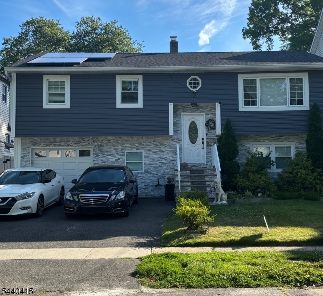 A RARE FIND! A BEAUTIFUL AND SPACIOUS HOME OFFERING COMFORTABLE LIVING .THE MAIN LEVEL FEATURES A BRIGHT LIVING ROOM ,DINING AREA ,FUNCTIONAL KITCHEN AND BEDROOMS.THE LOWER LEVEL PROVIDES ADDITIONAL LIVING SPACE,HOME OFFICE OR GUEST SUITE.ENJOY A PRIVATE BACKYARD,A SIGHT TO BEHOLD.SOLAR PANEL LEASED