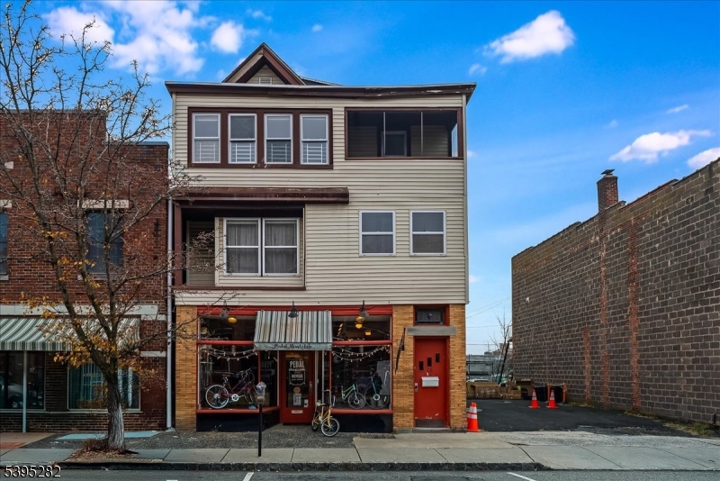 The most unique opportunity available in the commercial district of Montclair.  Less than 1/2 block from Bloomfield Ave on charming Midland Ave., the mixed-use  3-story is  comprised of a 1,700 sq ft. occupied retail unit w/ 2nd fl. office; a 2nd fl. 2 -bedroom apartment and a 3rd fl 3-bedroom apartment , both delivered vacant.  In addition there is a buildable 25' x 75' parking lot. The existing building has an unfinished, dry basement and has a fully upgraded electrical service with separate tenant metering. The property abuts the municipal Maple Ave parking lot accessed from Bloomfield Ave or Porter Place.  A Survey, floor plans  and aerial video are included in this listing.  Signed architectural drawings of a proposed building are available upon request.