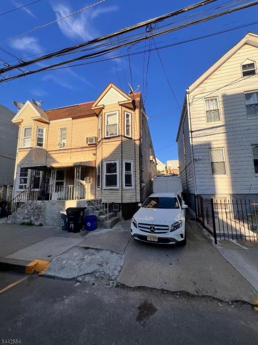 Excellent investment opportunity or owner-occupant property in the desirable North Newark section! This move-in-ready 2-family home features a spacious vacant first-floor unit with 2 bedrooms, offering the perfect opportunity for an owner-occupant or to generate additional rental income at market rent. The second-floor unit offers 3 bedrooms and is currently rented for $2,100 per month. The fully finished basement provides additional living space and is currently rented for $1,100 per month. The property has a long private driveway with ample off-street parking, a highly sought-after feature in Newark. Well maintained and ready for its next owner, this property offers strong income potential while allowing an owner to move right in. Conveniently located near transportation, major highways, shopping, schools, and parks. Whether you're looking to expand your investment portfolio or live in one unit while collecting rental income from the others, this is an opportunity you don't want to miss!