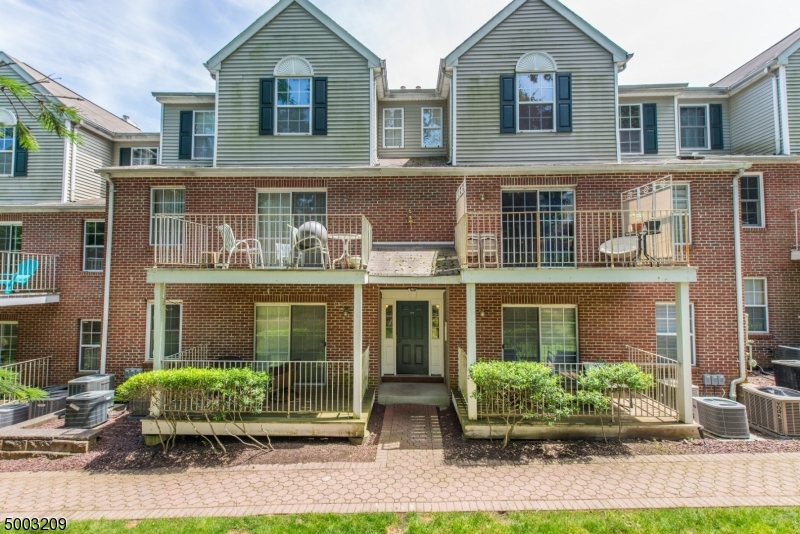 Move in ready townhouse in prime location in Morristown! Bright and spacious living and dining space in this beautiful unit with a gas fireplace in the living room. Hardwood floors throughout home. Den has French doors providing extra living space. Kitchen features granite countertops and stainless steel appliances. The upstairs master suite has added privacy, ample space, a walk-in closet and large bathroom. Unit has an extra storage space in basement and washer & dryer in unit. Ideal for commuters, walking distance to train station and downtown Morristown. Come check it out!