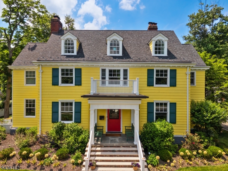 Set across from Edgemont Park, this beautifully updated Colonial home blends the timeless elegance of early 1900s architecture with modern amenities designed for today's lifestyle. This freshly painted (interior and exterior) home offers 6 bedrooms  and 4.5 baths. It provides exceptional space for both everyday living and entertaining. The thoughtfully designed floor plan features formal Living and Dining Rooms, a warm Family Room, library, screened porch, finished lower level, mudroom, and convenient second-floor laundry. At the heart of the home, the gourmet Kitchen is outfitted w/premium appliances, including a commercial-sized refrigerator/freezer, double ovens, oversized wine cooler, Miele coffee station, dramatic waterfall island + oversized undermount sink. A Butler's Pantry adds both functionality and style. The screened porch opens to a professional outdoor grilling area, while the expansive Bluestone patio overlooks a fully fenced fantastic backyard complete w/playground + treehouse. Ideally located just moments from Watchung Plaza's shops and restaurants, w/ train service to NYC via Penn Station and Hoboken, this exceptional property offers the perfect balance of historic character, modern luxury, and unbeatable location. Edgemont Park features a historic pond, perfect for fishing or turtle and duck watching and a large playground. This is the perfect space for relaxing or if the pond is frozen you can ice skate! Don't miss this rare opportunity to make it yours.
