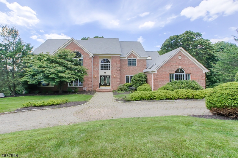 Stunning 5200 sq ft brick front colonial in fabulous, quiet neighborhood.  This house has it all, 2 story foyer, high ceilings, hardwood floors, updated chef's kitchen that opens to family room & french doors to deck, formal living & dining room, office with built-ins, great room with fireplace & vaulted ceiling, 1st floor bedroom/office with full bath, laundry room & powder room.  Second floor features a fantastic master suite with vaulted ceiling, 2 walk in closets, sitting room & luxury master bath, princess suite, 2 additional bedrooms & main bath.  Lower level offers a rec room with sliders to backyard, storage & utility rooms.  Professional landscaping, 3 car garage & more!  Close to schools, highways, transportation, etc.