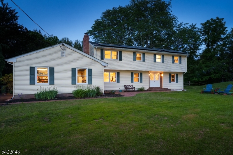 Just 3 miles from Princeton, in Montgomery Township, this reimagined five-bedroom home delivers the upgrades today's buyers are looking for. A 2022 renovation introduced a first-floor suite with its own bath and private entrance offering flexibility for guests or extended stays. Upstairs, an ensuite featuring a full bath alongside a stunning primary suite that features a newly designed bath that showcases a garden tub, oversized shower, sleek floating vanities, all overlooking a beautiful yard.  Skylights and oversized windows pour in natural light, while a custom walk-in closet adds a serious wow factor. Three of the five bedrooms enjoy ensuite baths, with a well-placed hall bath to service the remaining bedrooms. Second floor laundry is convenient. The open floor plan flows seamlessly into a standout kitchen, where quartz countertops, induction cooking and exceptional storage elevate everyday meals. Large, newly expanded windows throughout the home bring in natural light at every turn. Finished basement is ready for movie night with built in screen and surround sound. Practical upgrades include a newly upgraded septic system, an electric vehicle charger and a fully fenced yard. Thoughtful renovations with versatile spaces, smart technology such as owned solar panels and a new generator ready electrical panel, come together to create this amazing property that has a flexible floorplan with multiple primary bedroom options.