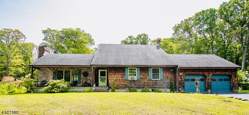 Turn onto the paved driveway, and enter your private 5+ acre retreat set back off the road.  Home features a beautiful brick and cedar exterior and a rustic charm that combines with modern conveniences.  Renovated in 2015, this home features a first floor master, beautifully appointed kitchen with SS appliances, hardwood floors, and multiple fireplaces for ambiance and low cost heating.  Kitchen flows easily into the dining and living room and then out to the covered and screened porch room and rear decks.  Backyard features the beautiful fenced in ground pool and screened pool house. Fully finished basement.