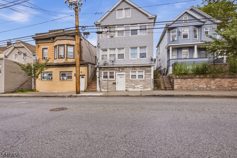 Welcome to 148 Palisade Ave, a beautifully renovated 3-family home offering expansive layouts, modern updates, and exceptional income-producing potential in Garfield. The first and second units each feature three spacious bedrooms, one full bathroom, bright living rooms, and functional eat-in kitchens, providing comfortable layouts for everyday living. The third unit spans two levels and offers five spacious bedrooms, one full bathroom, and one half bathroom, creating an impressive owner's-style layout with abundant living space. All three units showcase updated kitchens, generous room sizes, and thoughtfully designed interiors that blend comfort and functionality. With a total of eleven bedrooms, three full bathrooms, and one half bathroom across the property, this move-in-ready multi-family is an outstanding opportunity for investors or owner-occupants seeking strong rental potential. Conveniently located near transportation, shopping, parks, schools, and major commuter routes, this versatile property is one you don't want to miss. Grab it before it's gone!