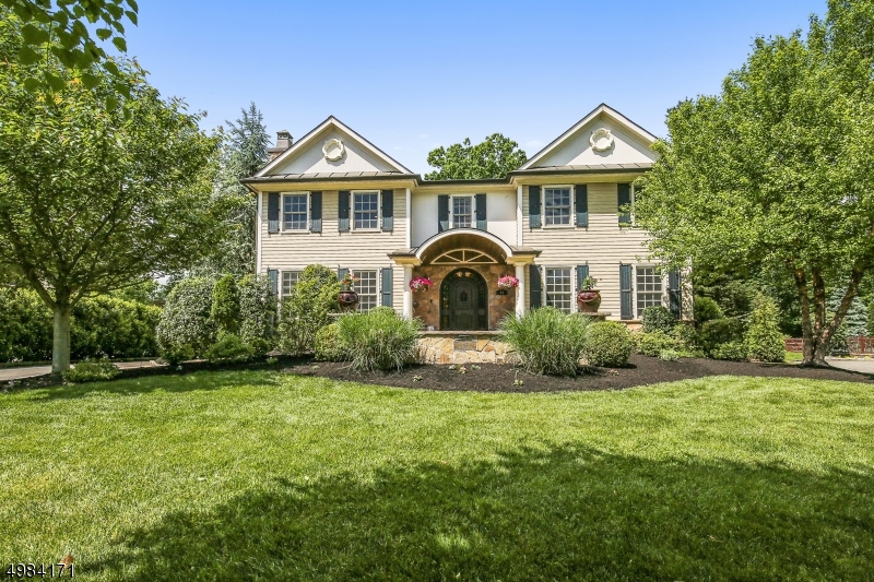 Magnificent custom built stone & shingle Center Hall Colonial w/smart house features ideally located on .54 acres of beautiful, totally level fenced property in Poets section. 9' high ceilings 1st level, incredible natural light. 2-story family room totally open to spectacular gourmet eat-in kitchen w/ walk-in pantry & butler's pantry. Both rooms have easy access to outdoor patio w/ wood burning fireplace, summer kitchen w/pizza oven, room for a pool on property. 1st fl guest suite. Luxurious master suite w/ 14'9" vaulted ceiling & huge WIC & spa-like master bath w/ jacuzzi & steam shower. 4 more bedrooms + 3 more baths on 2nd level. Finished 3rd level & lower level w/ a massive walk-in wine cellar, huge rec/media rom & guest suite. Walk to highly rated Hartshorn Elementary (0.6 miles)!